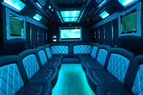 multiple tv screens on a party bus